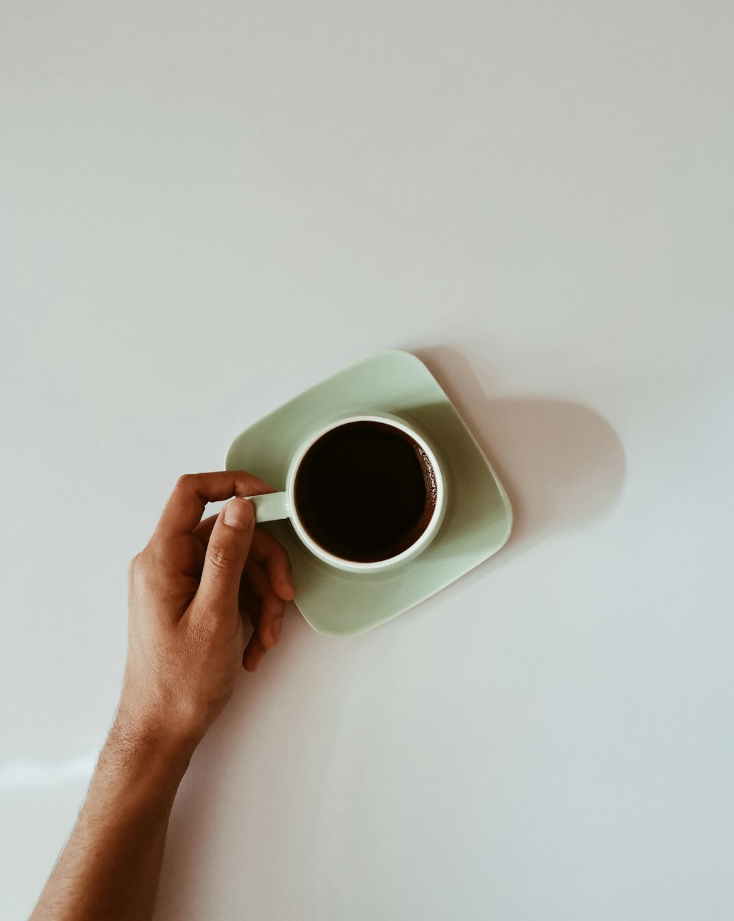 person drinking morning coffee