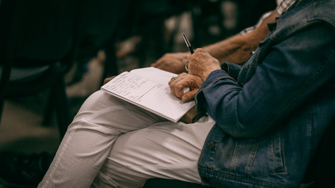 sociologist taking notes